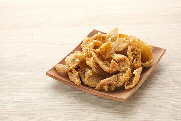 Crispy Fried Chicken Skin (Kulit Ayam Krispi) served on plate
