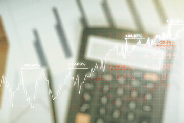 Multi exposure of virtual abstract financial graph interface on blurry calculator and papers background, financial and trading concept