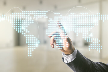 Man hand working with abstract virtual world map with connections on blurred office background, international trading concept. Multiexposure