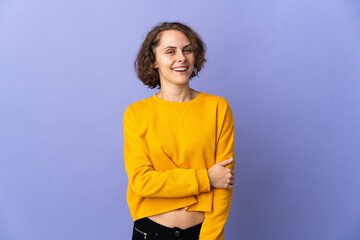 Young English woman isolated on purple background laughing