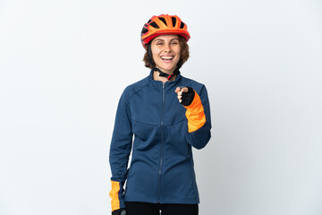 Young English cyclist woman isolated on white background surprised and pointing front