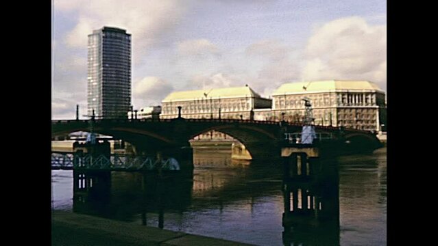 LONDON, UNITED KINGDOM - CIRCA 1979: Lambeth Pier on Albert Embankment and Lambeth Bridge on river Thames, ferry cruises. By Westminster Palace with Big Ben clock tower. Historic 1970s footage