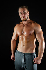 Fototapeta na wymiar Young handsome guy on a diet. A man with a beautiful athletic body. 