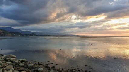 Peaceful, relaxing sunset sky reflecting over calm ocean in the tropics of Timor-Leste, Southeast Asia
