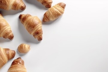 Fototapeta premium Croissants on white background copy space top view. AI generated