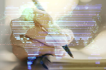 Abstract creative world map and woman hand writing in notebook on background, international trading concept. Multiexposure