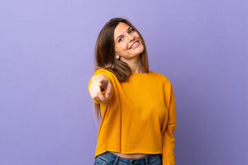 Fototapeta na wymiar Young Slovak woman isolated on purple background pointing front with happy expression