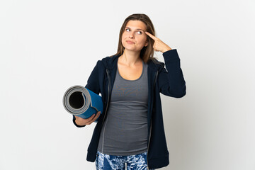 Slovak girl going to yoga classes isolated on white background having doubts and thinking