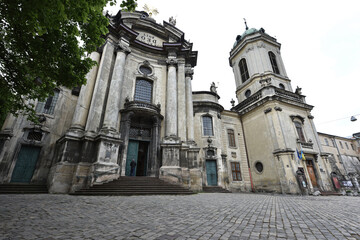 Fototapeta premium The Dominican Church or Church of the Holy Eucharist in the central part of Lviv. entrance to the church. is also known as Lvov. European city. beautiful old building. Ukraine, Lviv