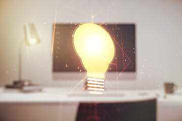 Double exposure of creative light bulb hologram on laptop background, research and development concept