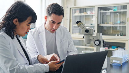 Multinational researcher group experimenting in the lab. Research and Development.