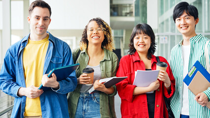 Multinational group smiling inside the building. International students.