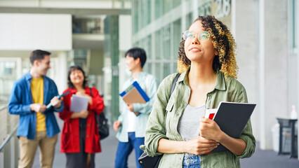 Multinational group smiling inside the building. International students.