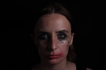 Fototapeta premium Portrait of an upset crying woman, the concept of mourning, violence