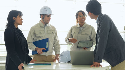 Group of multinational engineers and business people meeting in a building. 　International business.