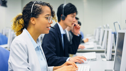 Fototapeta premium Multinational operator group working in the office. Call center. Customer support staff.