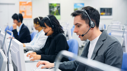 Multinational operator group working in the office. Call center. Customer support staff.