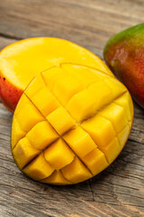 Mango. Fresh tropical fruit on a wooden background. place for text, top view