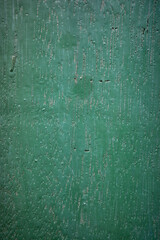Fototapeta premium a photo of a flat wooden board surface. This board has a weathered, scratched, and aged appearance over time, with a teal color