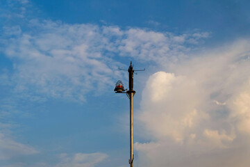 close up of lightning rod tower and lights against sky background