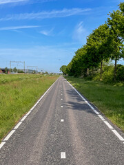 Pedal alongside the rhythmic flow of trains on a bike lane parallel to the tracks, where adventure and urban vibes converge in a unique and dynamic journey