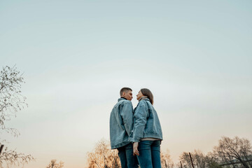 stunning sensual young couple in love posing at the sunset, happy lifestyle concept