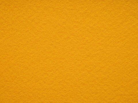 Bright orange matt felt material blank. Surface of felted fabric texture background. High resolution photo. Pattern for text, lettering, 3d, patchworkor other art work.