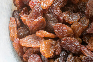 closeup macro image of raisin. (top view) a raisin is a dried grape. stock images, selective focus. vienna, austria, 16 may 2023
