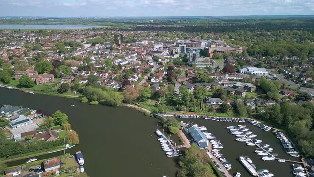 The drone aerial footage of Thames River and town center of Walton-on-Thames. Walton-on-Thames, known locally as Walton, is a market town on the south bank of the Thames in northwest Surrey, England.