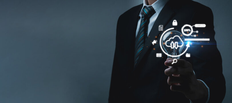 Cloud Computing Technology. businessman investor hand holding light bulb with cyber security graphic icon diagram, internet security, business finance, digital marketing, file data transfer concept - Powered by Adobe