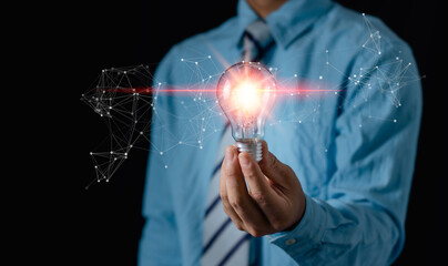 Creative thinking ideas and innovation technology,inspiration concept. Businessman holding a light bulb and imagination,Solution analysis and development network connection..