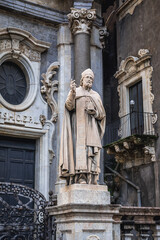 Fototapeta na wymiar Statue in front of Cathedral of Saint Agatha in historic part of Catania, Sicily Island in Italy
