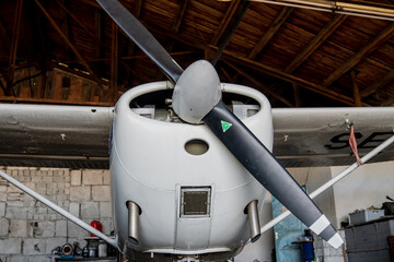 Small white airplane with black aircraft propeller