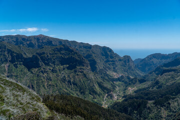 Fototapeta na wymiar A breathtaking aerial view of the Madeira mountain range, showcasing its lush valleys and trees with tranquil plateaus. Nature at her finest!