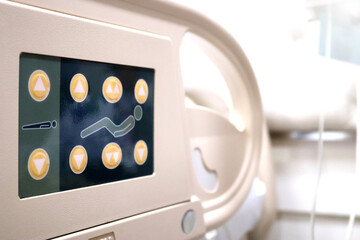 Close up button of adjustable beds in room at hospital without patient.