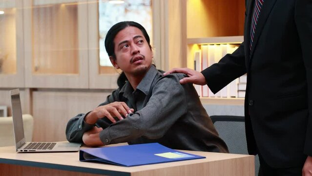 Exhausted tired Asian businessman slepping in home office work place.