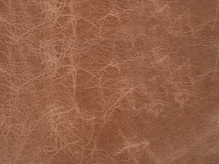 Soft dark beige leather natural texture, matte material, abstract background.