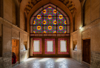 Fototapeta na wymiar Beautiful colored glass windows in the palace of Arg of Karim Khan or Citadel in downtown Shiraz, Fars Province, Iran. Heritage and tourist attraction.