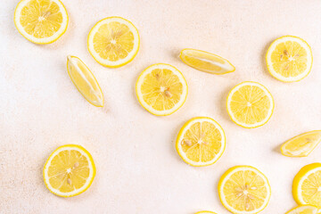 Fresh lemons on bright background. Lemon fruit citrus. Composition with whole, slices of lemons.