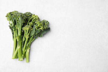 Fresh raw broccolini on white background, flat lay and space for text. Healthy food © New Africa