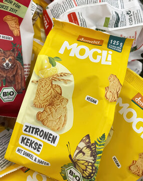 Viersen, Germany - May 9. 2023: Closeup of bags Demeter Mogli snacks  in shelf of german supermarket