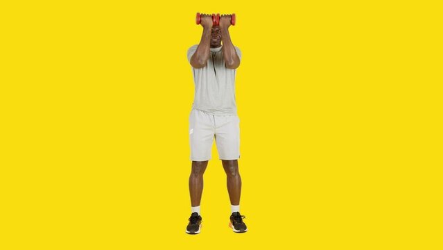 African man doing vertical pectoral contraction exercises with dumbbells