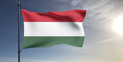Hungary national flag cloth fabric waving on beautiful grey sky Background.