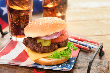 4th of July American Independence Day traditional picnic food. American Burger and cocktail, American flags and symbols of USA Patriotic picnic holiday on white wooden background. Top view