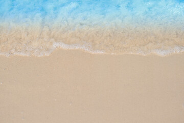 beautiful sandy beach and soft blue ocean wave. summer background concept