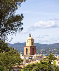 Fototapeta na wymiar Saint Tropez, view of the famous Notre Dame de l'Assomption church tower and the other side of the bay on the Cote d'Azur, French Riviera