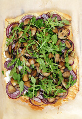Puff pastry tart with mushroom, rocket and ricotta cheese