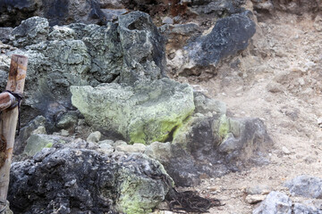 geothermal smoke vapor that comes out of the gaps in the rocks produces sulfur