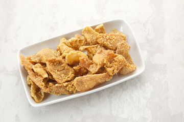 Crispy Fried Chicken Skin (Kulit Ayam Krispi) served on plate
