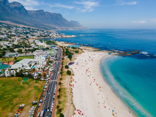 Fototapeta premium drone aerial view over Camps Bay Cape Town , Camps Bay beach drone aerial view during summer in Cape Town Sout Africa, drone view at the beach during summer